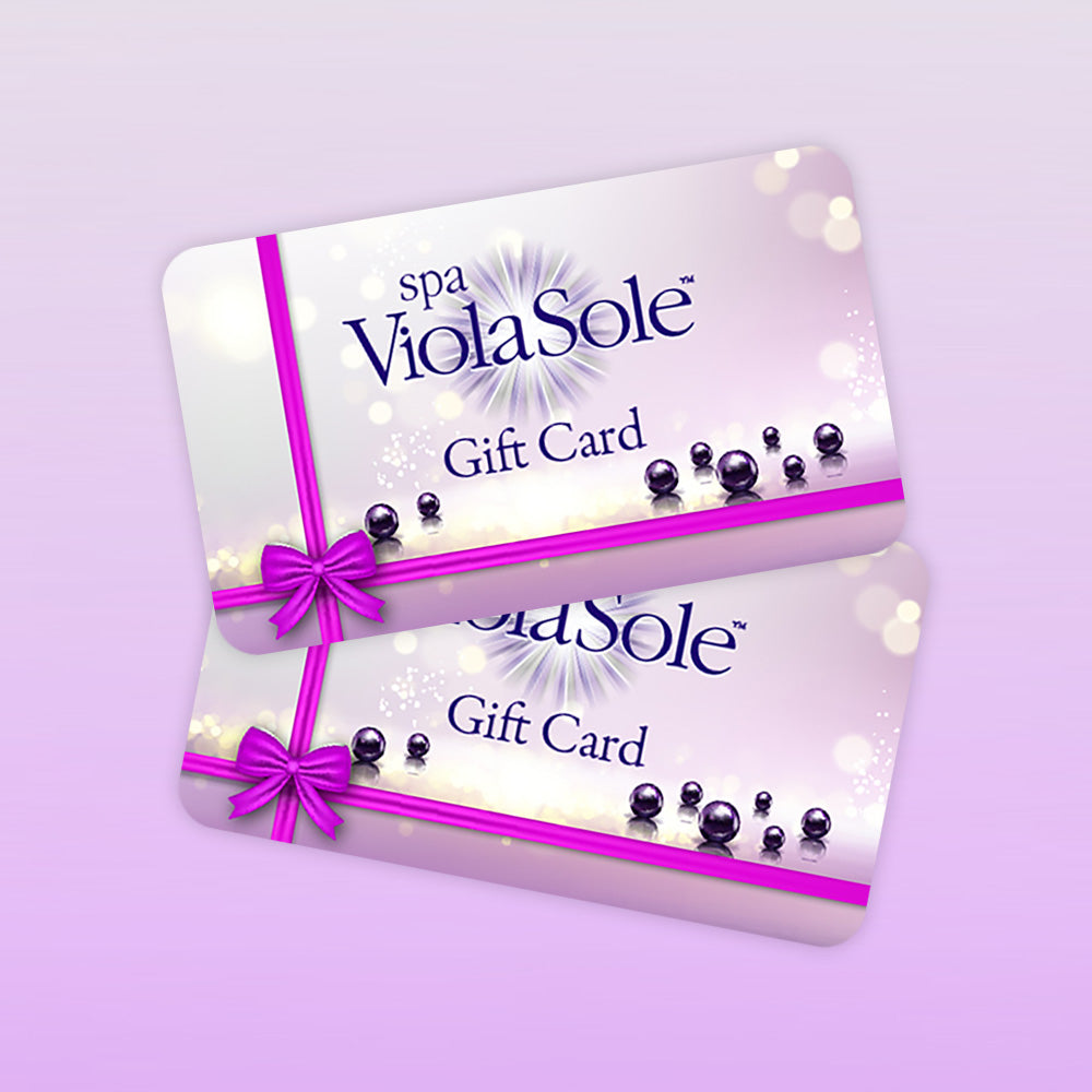 Two spa ViolaSole gift cards with a pink ribbon on a light purple background